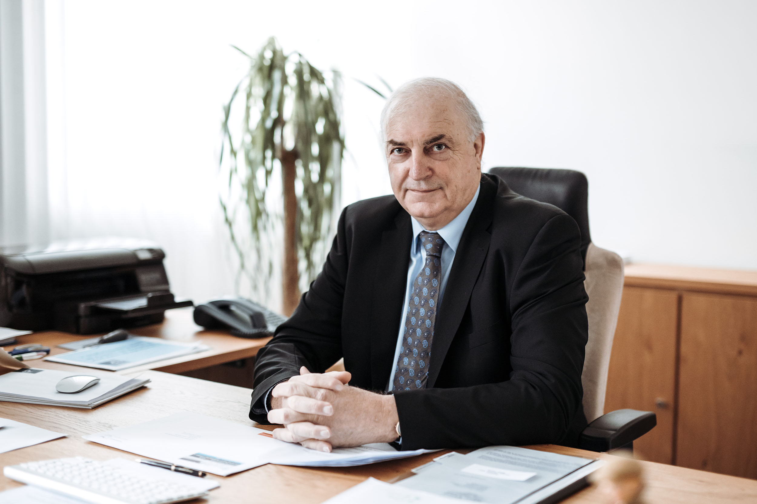 Charles Goerens is sitting at his desk.